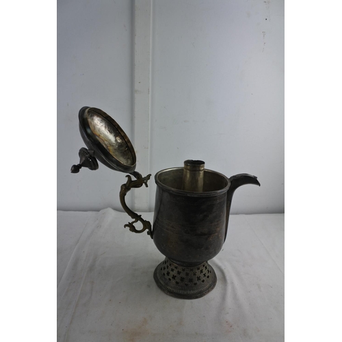 72 - An unusual large antique metal teapot with brass handle.