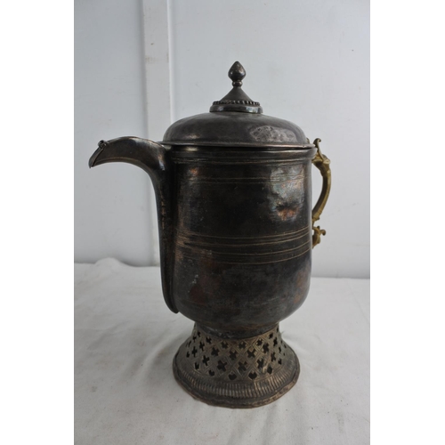 72 - An unusual large antique metal teapot with brass handle.