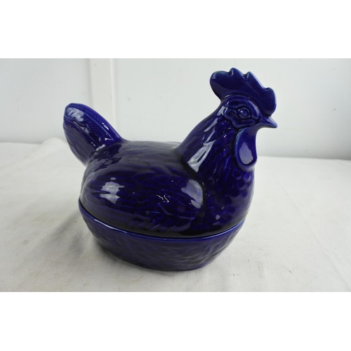 76 - A stunning blue ceramic hen on nest egg holder.