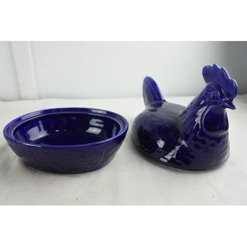 76 - A stunning blue ceramic hen on nest egg holder.