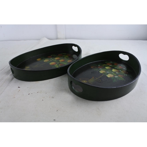 81 - A pair of small hand painted trays.