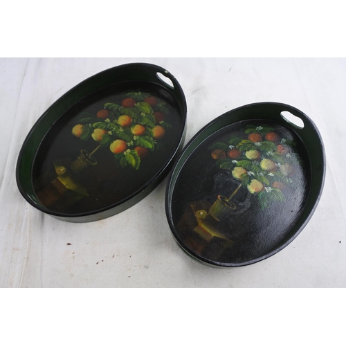 81 - A pair of small hand painted trays.