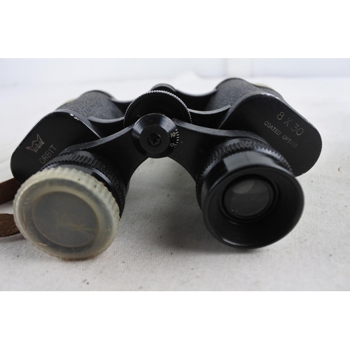 84 - A pair of vintage Orbit 8 X 30 binoculars and leather case.