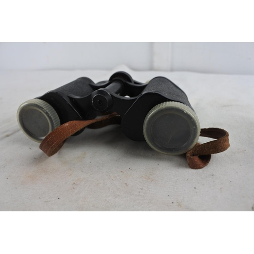 84 - A pair of vintage Orbit 8 X 30 binoculars and leather case.