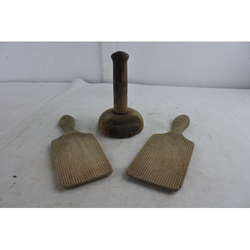 86 - An antique butter press and a pair of antique butter pats.