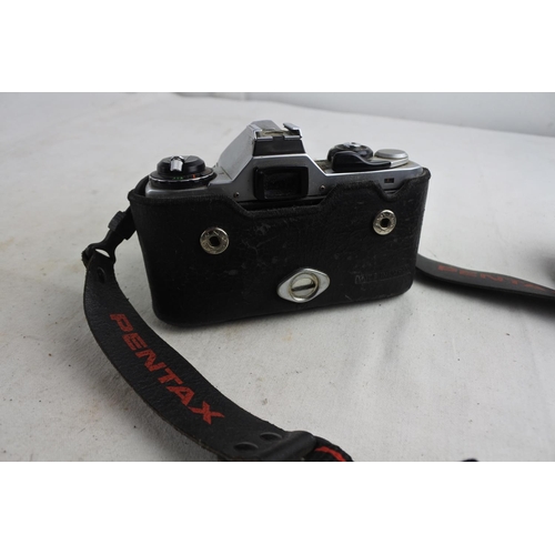 87 - A vintage Pentax camera and strap.