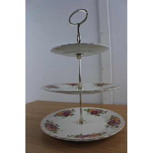 210 - A Myott 'Rose Garden' three tier cakestand.