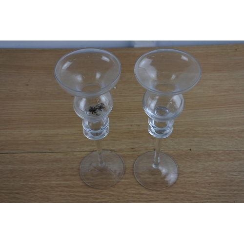 213 - A pair of glass candlesticks.