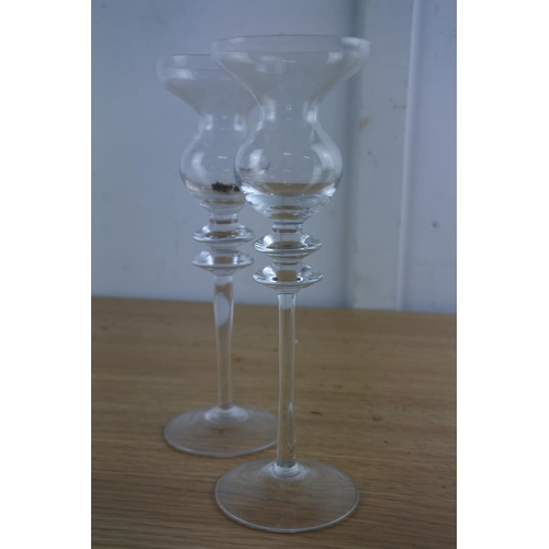 213 - A pair of glass candlesticks.