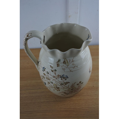 214 - An antique 'Floribel'  water jug