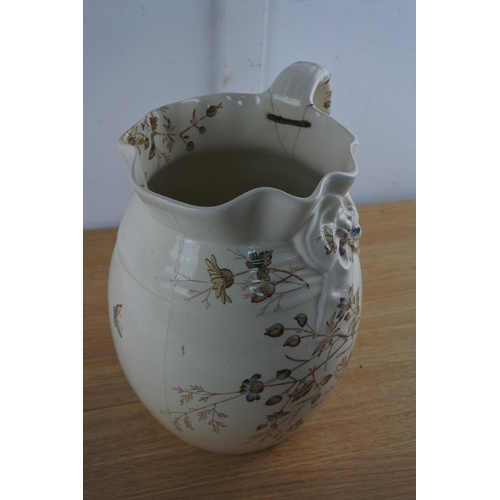 214 - An antique 'Floribel'  water jug