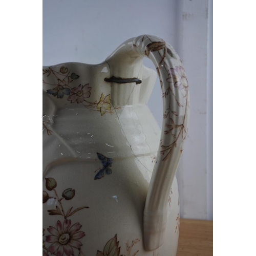 214 - An antique 'Floribel'  water jug