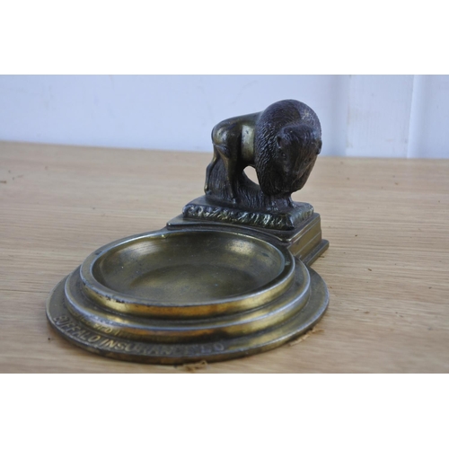 218 - A vintage advertising dish for Buffalo Insurance Company, with bronze buffalo figure.