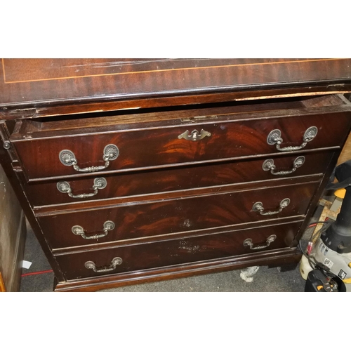 231 - An antique mahogany writing bureau and key.