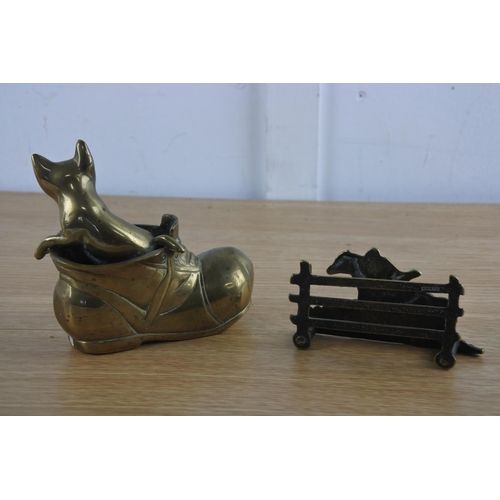 235 - A brass ornament of a cat and boot and a brass letterholder.