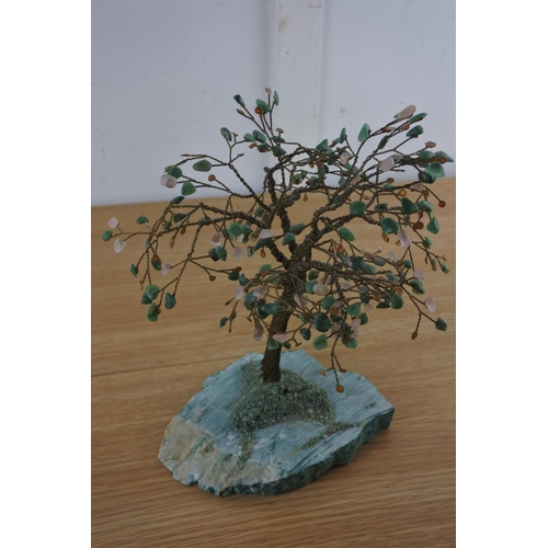 241 - A vintage ornamental metal and precious stone tree on a marble base.