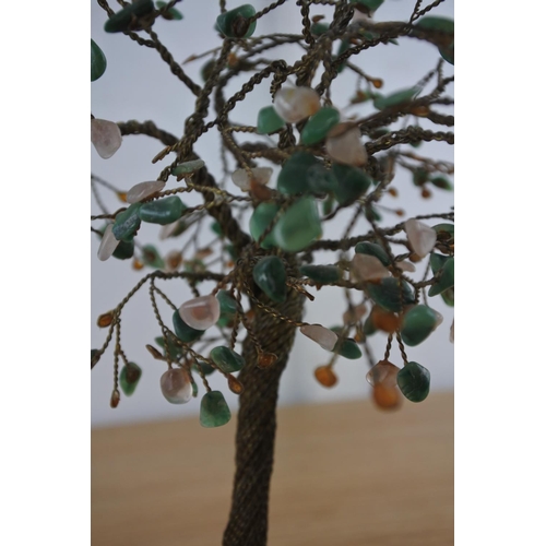 241 - A vintage ornamental metal and precious stone tree on a marble base.