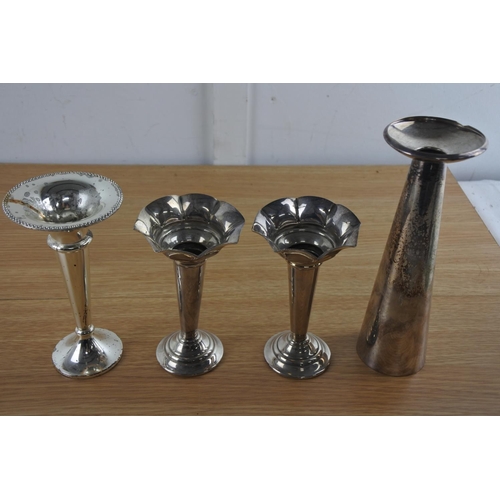 242 - A Falstaff silver plated candle holder and three others.