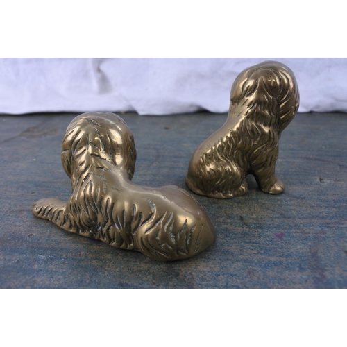 261 - A pair of brass dog ornaments.