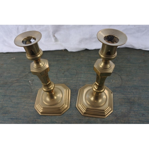 267 - A pair of brass candlesticks.