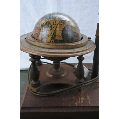 272 - An unusual globe of the world mounted on a table lamp base.