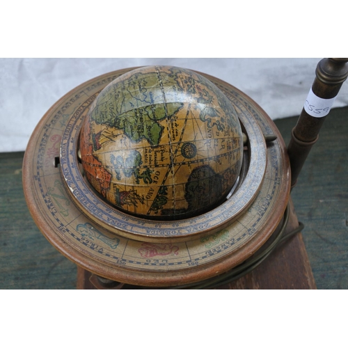 272 - An unusual globe of the world mounted on a table lamp base.