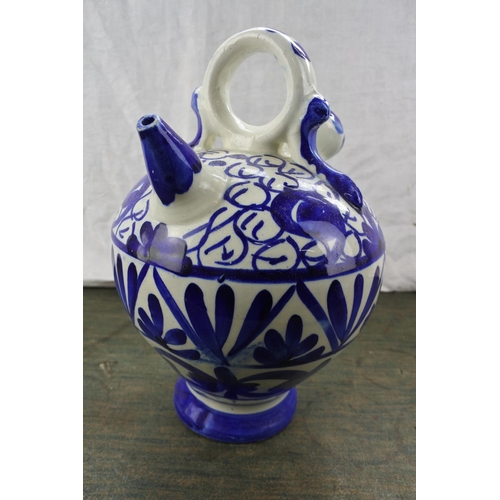 276 - A blue and white patterned flagon.