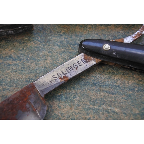 281 - A vintage cased Solingen cut throat.