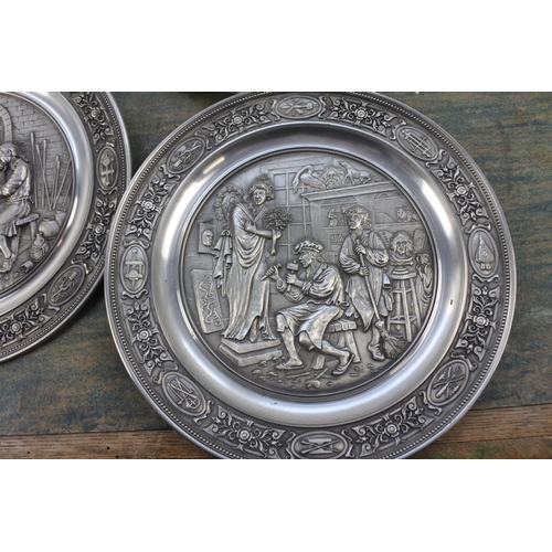 287 - Seven German pewter collectors plates.