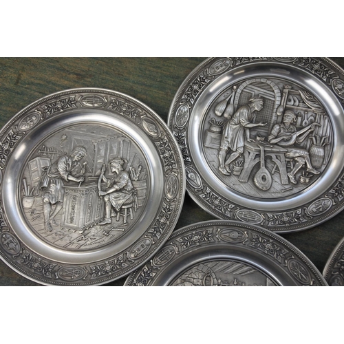 287 - Seven German pewter collectors plates.