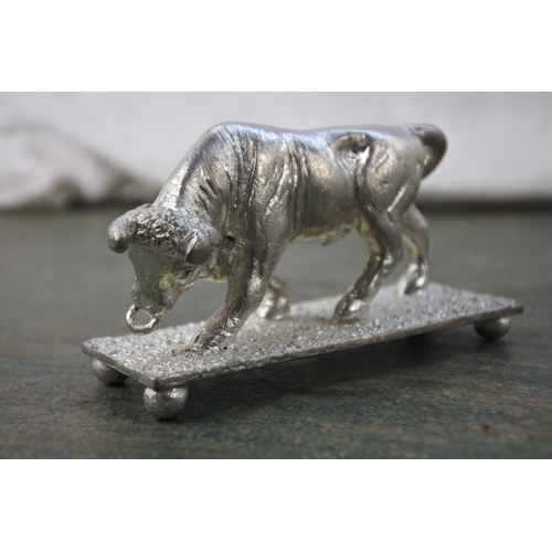 288 - A small Irish pewter figure of a bull.