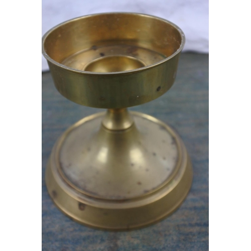 298 - A brass effect candleholder.