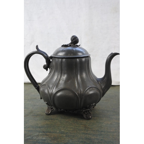 299 - An antique pewter teapot and a silver plated teapot.