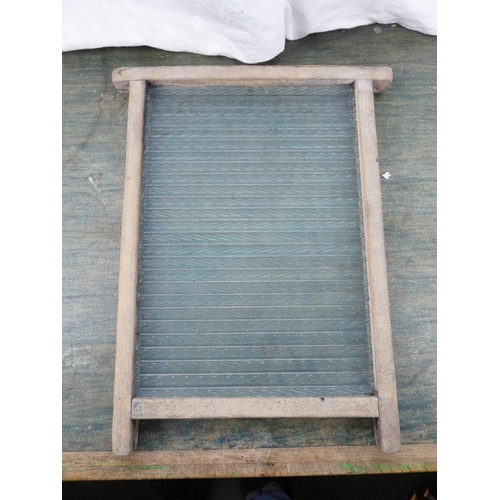 101 - A vintage glass washboard.