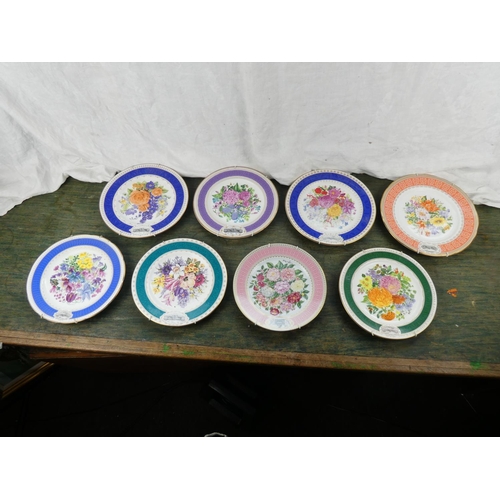 104 - A set of 8 Royal Horticultural Society flower patterned plates made by Royal Grafton.