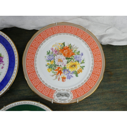 104 - A set of 8 Royal Horticultural Society flower patterned plates made by Royal Grafton.