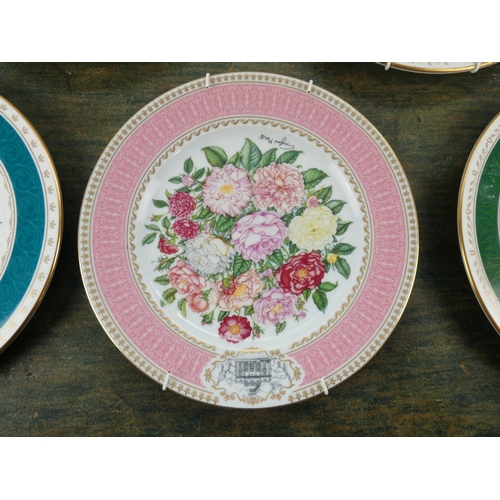 104 - A set of 8 Royal Horticultural Society flower patterned plates made by Royal Grafton.