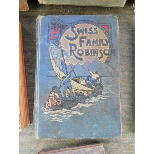 105 - A collection of antique and vintage books to include Alice in Wonderland by Lewis Carroll and more.