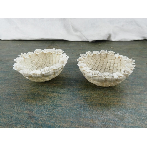 111 - An antique pair of Belleek pottery three strand baskets. (a/f)