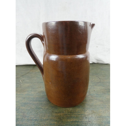 114 - An antique stoneware jug.