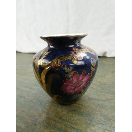 137 - A small hand painted Toyo 'Trumpet Flourish' Vase .