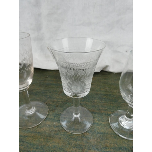 151 - A collection of vintage etched glasses.