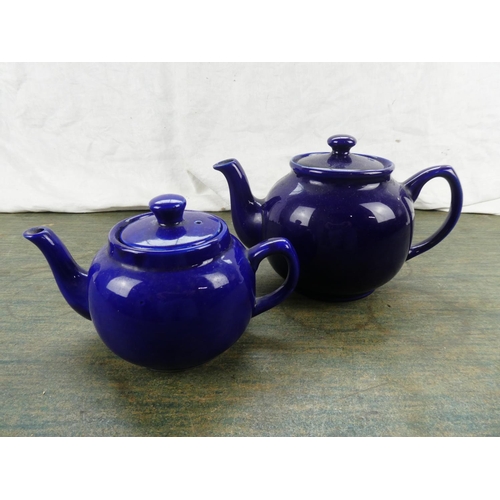 156 - Two blue glazed teapots.