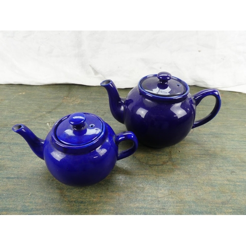 156 - Two blue glazed teapots.