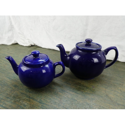 156 - Two blue glazed teapots.