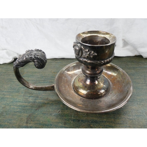 164 - A large silver plated scroll handle candleholder stamped Alpaca.