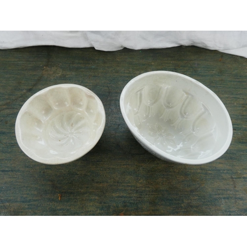 190 - Two antique jelly moulds.