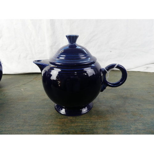 311 - A set of 4 vintage blue 'Fiesta' ware jugs (1 a/f)