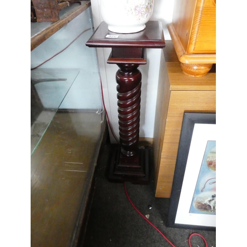 326 - A mahogany twisted base plantstand.