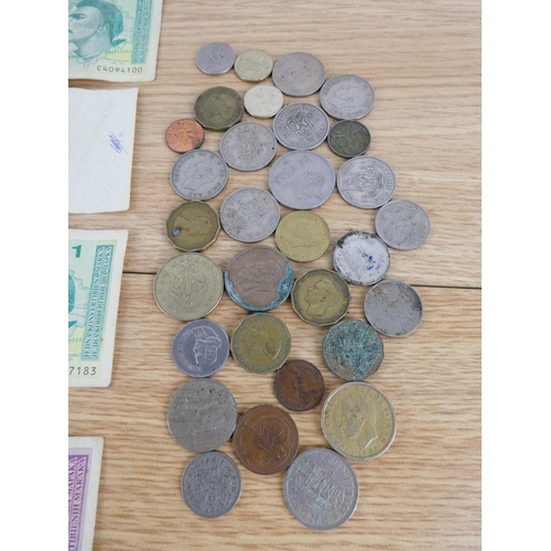 346 - A large assortment of coinage and bank notes.